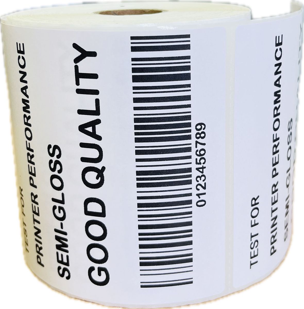 A roll of white thermal labels with text and a barcode, indicating the labels are for 'Good Quality' and 'Sem-Gloss' finish.